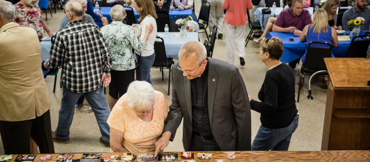 The Rev. Wally Arp, senior pastor of St. Luke's Lutheran Church, visits with Beverly Kilbey at a birthday party for a 100 year-old parishioner at Lutheran Haven on Saturday, March 5, 2016, in Oviedo, Fla. LCMS Communications/Erik M. Lunsford