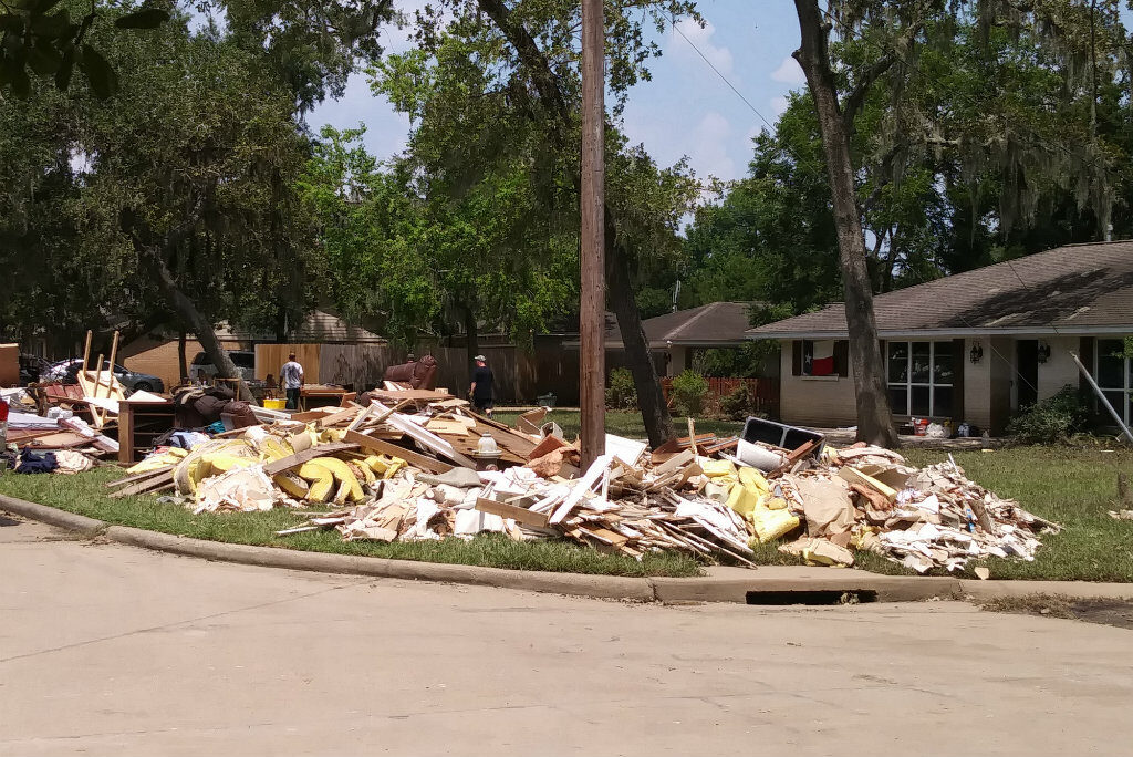 After the storm: Homes in Friendswood, ruined by feet of standing water, are being emptied of everything, Photo credit: Jennifer Davis