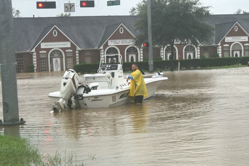 Zach Padgett (a friend of the author) uses his boat to rescue stranded neighbors in Friendswood. Photo credit: Karon Padgett